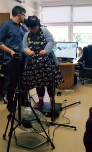 Cate Lawrence tries out the VR system created by KTU student
