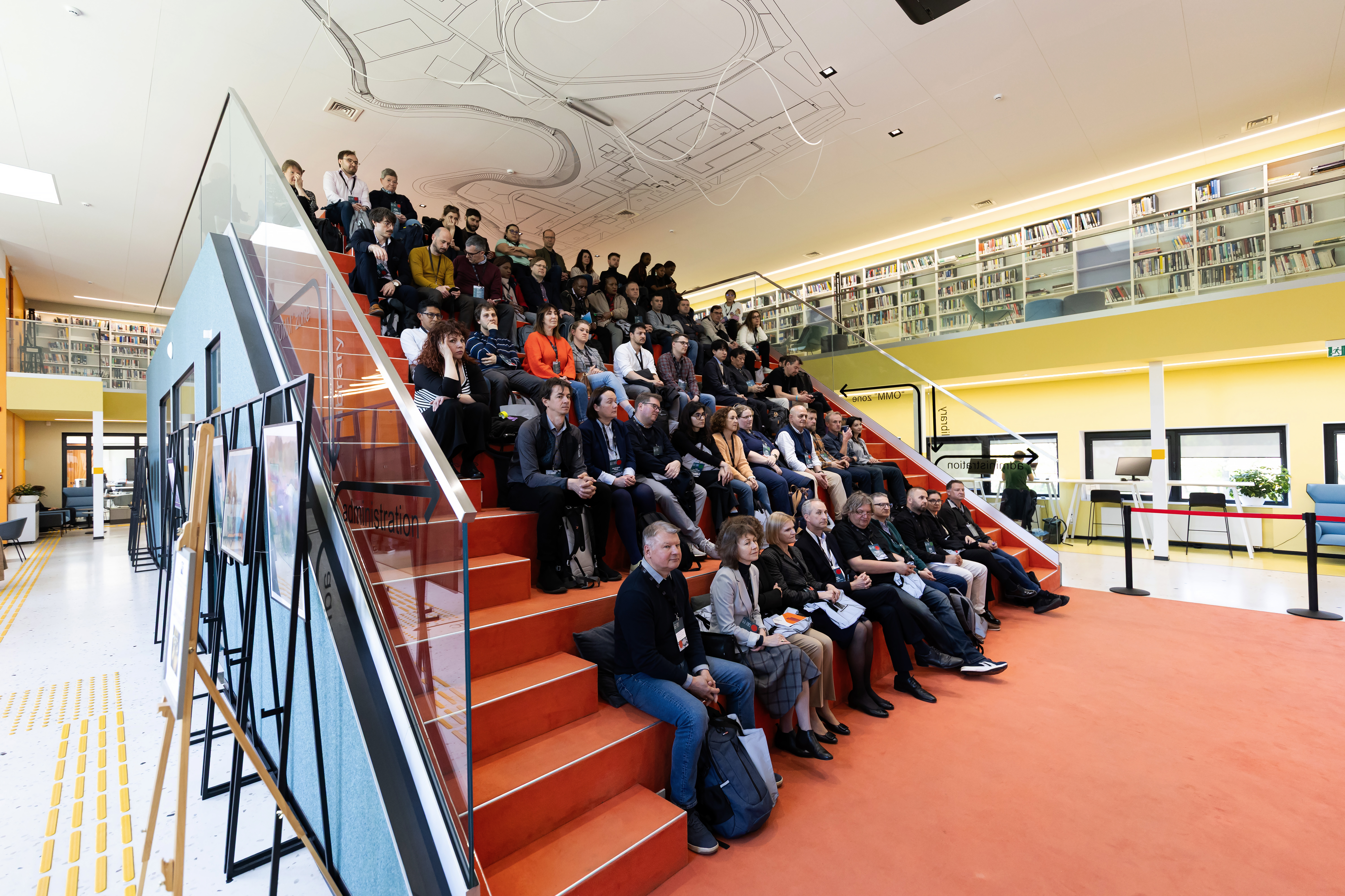 Participants sitting in the KTU library during opening of the KTU Global Faculty Week 2025