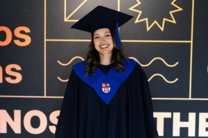 KTU student from Guatemala with a graduation gown on a graduation day