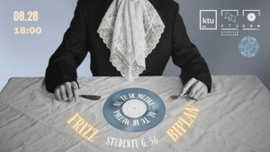 A blue plastic plate is lying on the table, with yellow and white text around it; a person is sitting at the table with a napkin and cutlery.