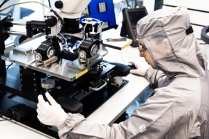 Scientist wearing overalls working in a cleanroom