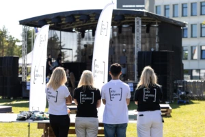 four people wearing KTU alumni tshirts