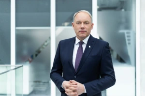 Man dressed in dark suit standing